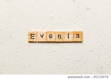 Events word written on wood block. Events text on cement table for your desing, concept 95119479