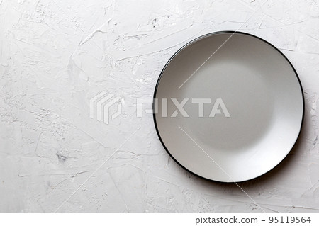 Top view of empty grey plate on cement background. Empty space for your design Top view of empty grey plate on cement background. Empty space for your design 95119564