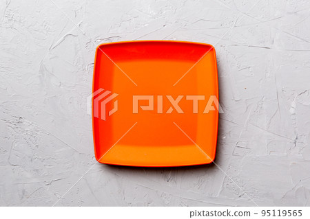 Top view of empty square plate on cement background. Empty space for your design 95119565