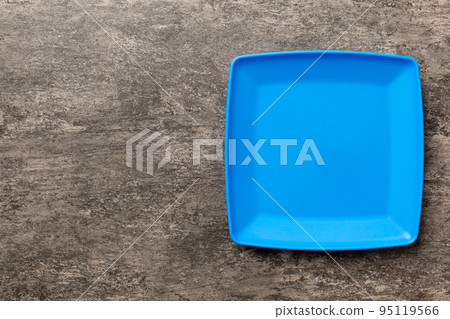 Top view of empty square plate on cement background. Empty space for your design Top view of empty square plate on cement background. Empty space for your design 95119566