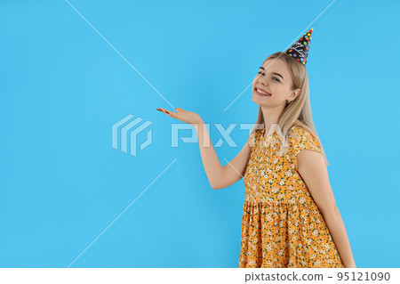 Concept of Happy Birthday, young woman on blue background 95121090