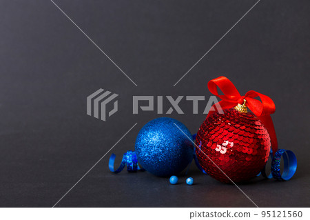 Christmas ball on colored background. decoration bauble with ribbon bow with copy space Christmas ball on colored background. decoration bauble with ribbon bow with copy space 95121560