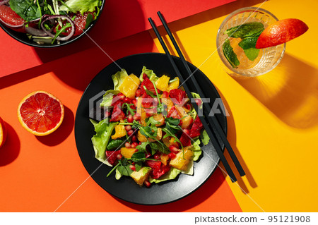 Concept of tasty food, salad with red orange, top view Concept of tasty food, salad with red orange, top view 95121908