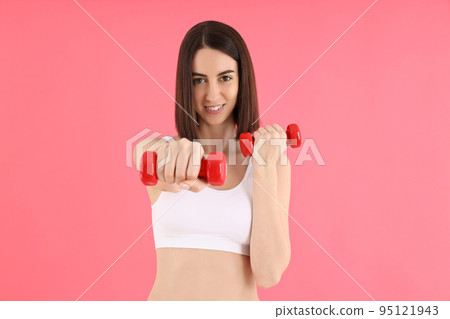 Concept of weight loss, young woman on pink background 95121943