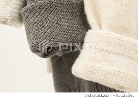 Hanging sweaters, concept of autumn season clothes 95122583