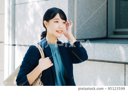 businesswoman walking in office 95123599