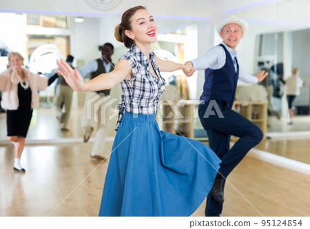 Woman and man dancing swing in studio Woman and man dancing swing in studio 95124854