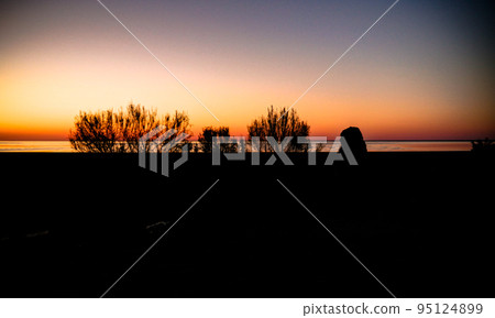 Sunrise Panorama view to Aral sea from the rim of Plateau Ustyurt near Aktumsuk cape in Karakalpakstan, Uzbekistan 95124899