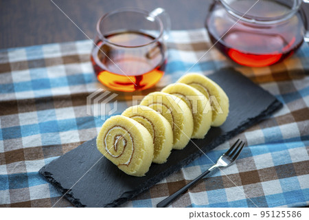 roll cake on slate plate roll cake on slate plate 95125586