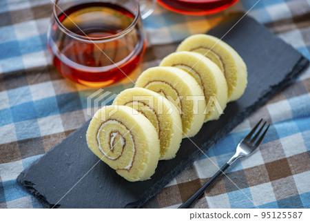 roll cake on slate plate roll cake on slate plate 95125587