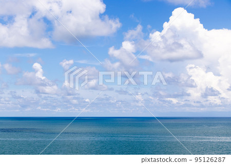 Beautiful calm turquoise color sea and blue sky with white color cloud background 95126287