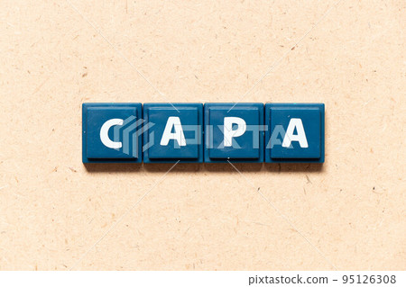 Tile letter in english word of CAPA (abbreviation of corrective action and preventive action) on wood background 95126308