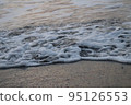 fine foam of the waves 95126553