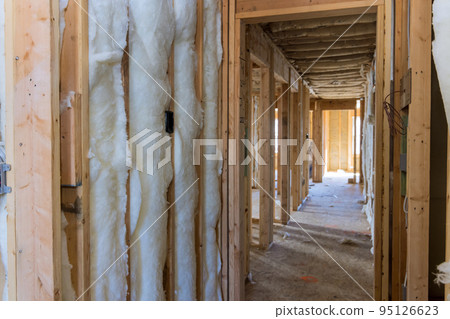 During construction process rock wool insulation may be placed in wooden frames for future walls to provide comfortable economically efficient cold barrier. 95126623