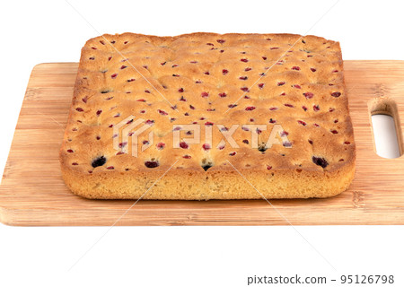 Wooden cutting board with freshly baked berry pie on a white background. Wooden cutting board with freshly baked berry pie on a white background. 95126798