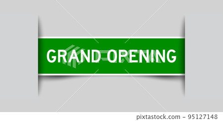Inserted green color label sticker with word grand opening on gray background Inserted green color label sticker with word grand opening on gray background 95127148
