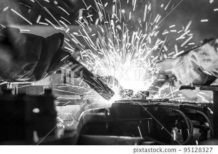 Industrial steel welder in factory 95128327