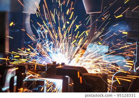 Welding robots movement in a car factory Welding robots movement in a car factory 95128331