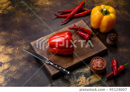 Fresh torn red sweet pepper from the autumn harvest Fresh torn red sweet pepper from the autumn harvest 95129007