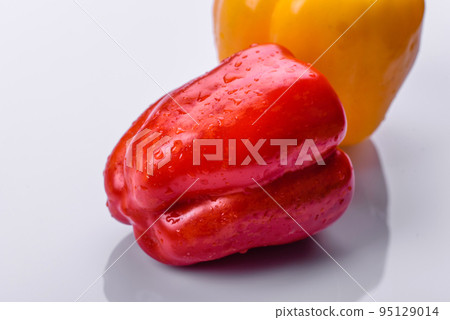 Fresh torn red sweet pepper from the autumn harvest Fresh torn red sweet pepper from the autumn harvest 95129014