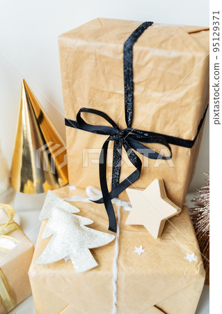 Christmas, gifts, Christmas tree, decorations. The concept of preparing for the holiday, buying and wrapping gifts. 95129371