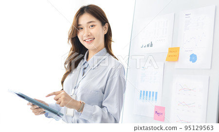 Office worker with a beautiful Asian woman in a private office, Daily routine of office workers, Welcome to work in the morning with a bright smile, Businesswoman in office concept. Office worker with a beautiful Asian woman in a private office, Daily routine of office workers, Welcome to work in the morning with a bright smile, Businesswoman in office concept. 95129563