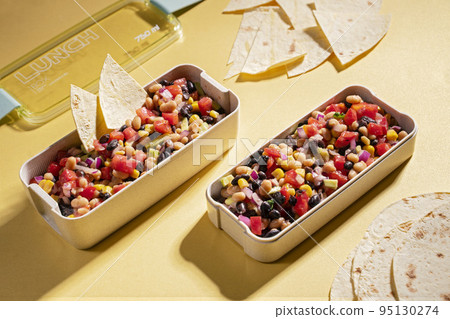 cowboy caviar, texas caviar with black bean, tomatoes, avocado, red bell pepper, corn in lunch box cowboy caviar, texas caviar with black bean, tomatoes, avocado, red bell pepper, corn in lunch box 95130274