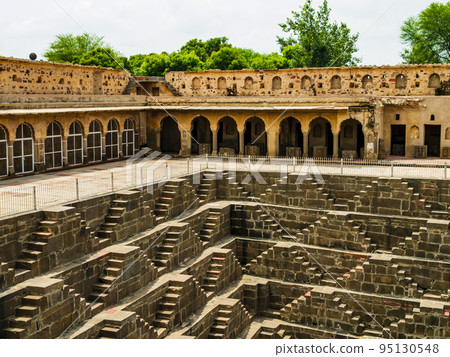 Impressive view of Chand Baori, the oldest and deepest stepwell in the world, Abhaneri village near Jaipur, Rajasthan, India Impressive view of Chand Baori, the oldest and deepest stepwell in the world, Abhaneri village near Jaipur, Rajasthan, India 95130548