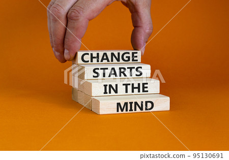 Change starts in the mind symbol. Concept words Change starts in the mind on wooden blocks on a beautiful orange table orange background. Business, motivational and change starts in the mind concept. Change starts in the mind symbol. Concept words Change starts in the mind on wooden blocks on a beautiful orange table orange background. Business, motivational and change starts in the mind concept. 95130691