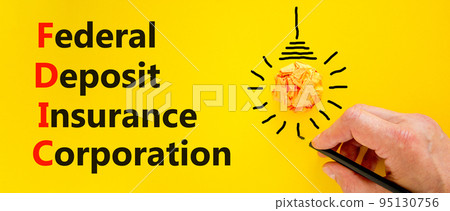 FDIC federal deposit insurance corporation symbol. Concept words FDIC federal deposit insurance corporation on yellow background. Business FDIC federal deposit insurance corporation concept. 95130756