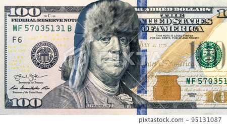 Energy crisis and money, 100 dollar bill with winter hat, president feeling cold Energy crisis and money, 100 dollar bill with winter hat, president feeling cold 95131087