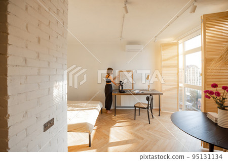 Woman at workplace at cozy home 95131134