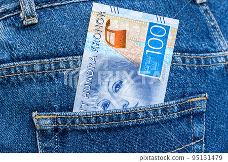 Swedish crown banknotes sticking out of the jeans pocket Swedish crown banknotes sticking out of the jeans pocket 95131479