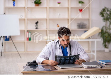 Young male doctor radiologist working in the clinic 95131894