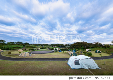early morning lakeside campsite 95132444