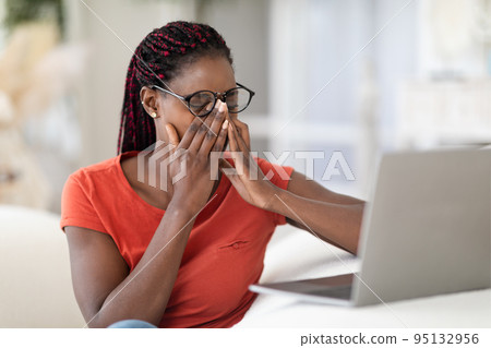 Black Freelancer Lady Suffering Eyes Strain While Working With Laptop At Home Black Freelancer Lady Suffering Eyes Strain While Working With Laptop At Home 95132956