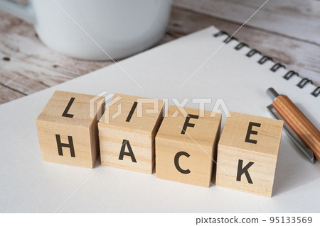 Blocks written LIFE HACK, notebooks, pens, cups Blocks written LIFE HACK, notebooks, pens, cups 95133569