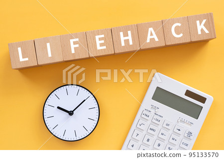 A block written LIFEHACK, a clock and a calculator A block written LIFEHACK, a clock and a calculator 95133570