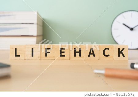 A desk with a block written as LIFEHACK A desk with a block written as LIFEHACK 95133572