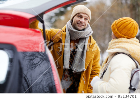 Couple By Car in Winter Couple By Car in Winter 95134701