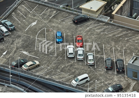Cars parking on a rooftop Cars parking on a rooftop 95135418