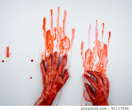 Female hands in blood on a white background.  95137646