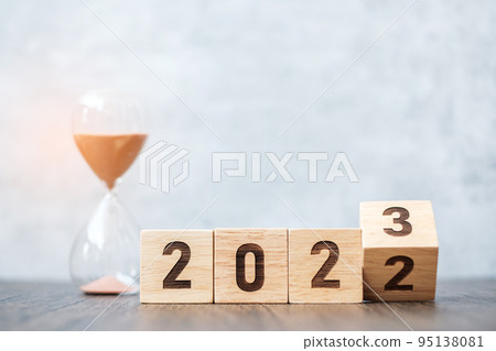 flip block 2022 to 2023 text with hourglass on table. Resolution, time, plan, goal, motivation, reboot, countdown and New Year holiday concepts flip block 2022 to 2023 text with hourglass on table. Resolution, time, plan, goal, motivation, reboot, countdown and New Year holiday concepts 95138081