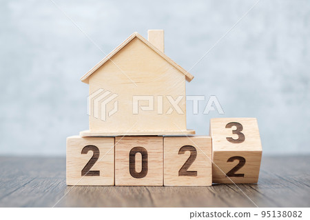 flip 2022 to 2023 block with house model. real estate, Home loan, tax, investment, financial, savings and New Year Resolution concepts 95138082