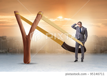 Businessman being launched from slingshot in career concept 95140711