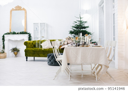 Decorated festive table. Christmas decorations for home in the living room or dining room 95141946
