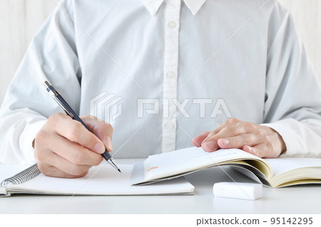 Hand of a person who works hard to study 95142295