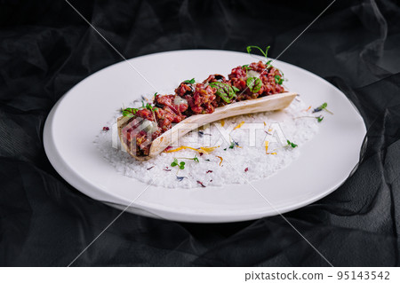 Exquisite serving beef tartare on plate 95143542