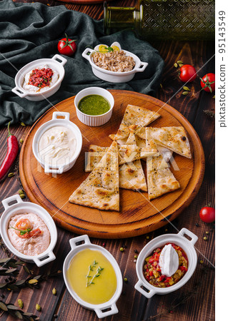 Italian focaccia bread with antipasti, top view Italian focaccia bread with antipasti, top view 95143549