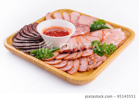 Assorted deli cold meats on wooden tray Assorted deli cold meats on wooden tray 95143551